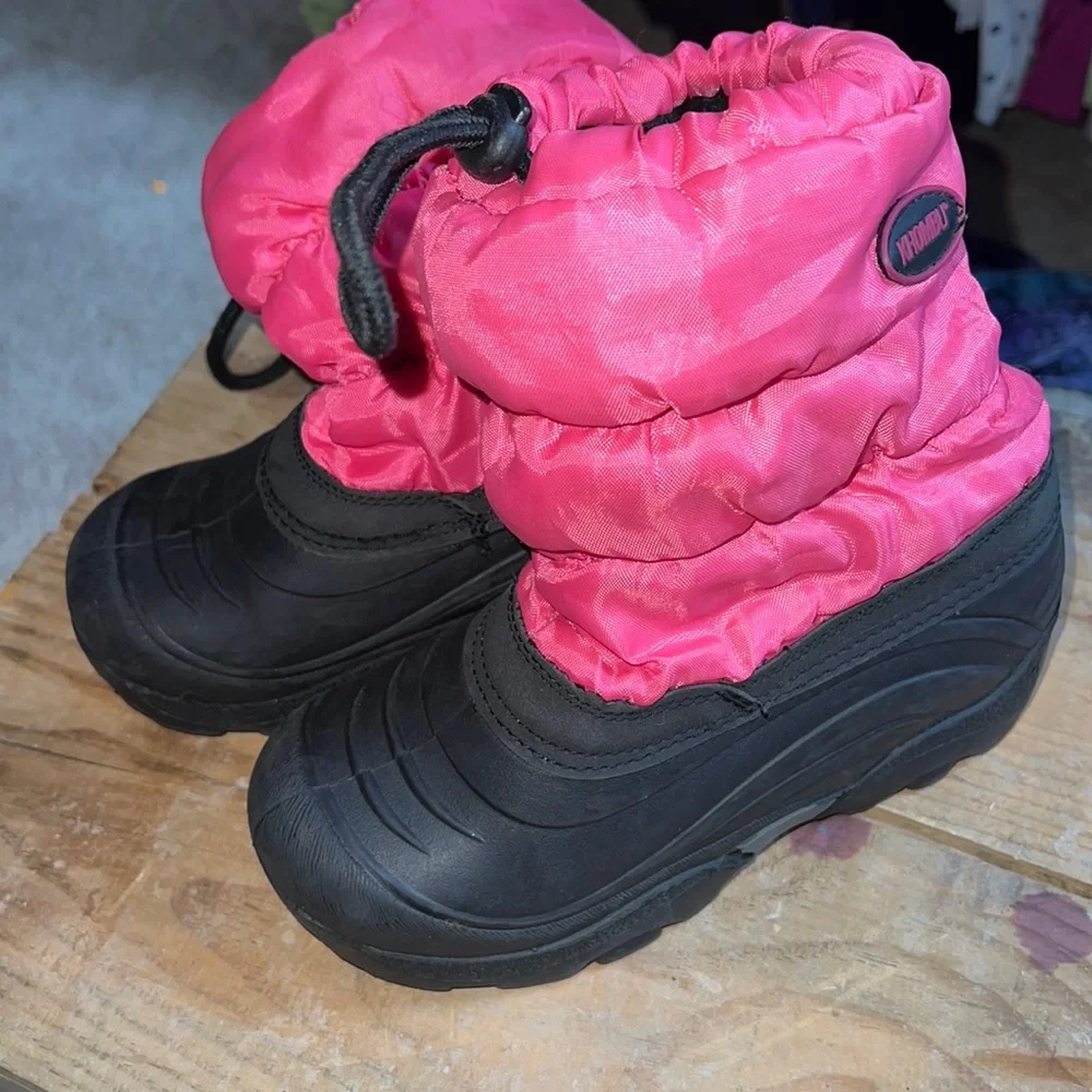 Size 13 girls winter snow boot by Khombu. Pink and black. Lightly worn.